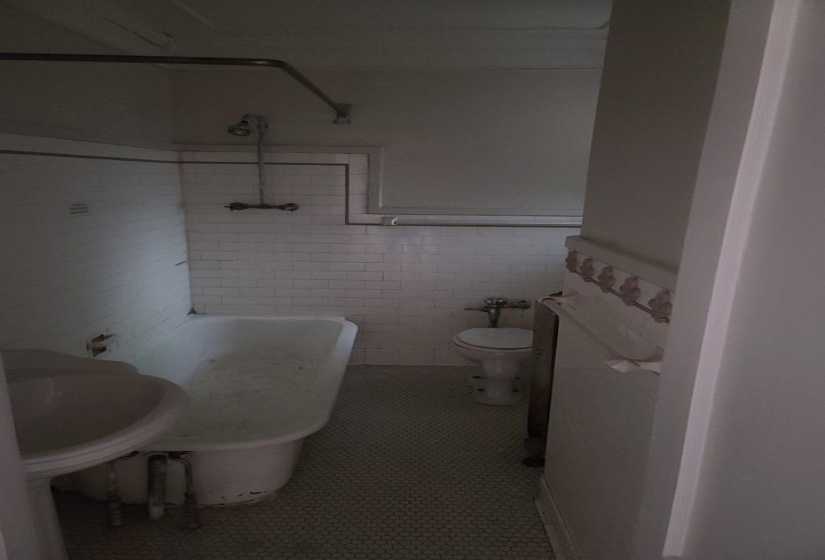Bathroom with tile walls and wainscoting