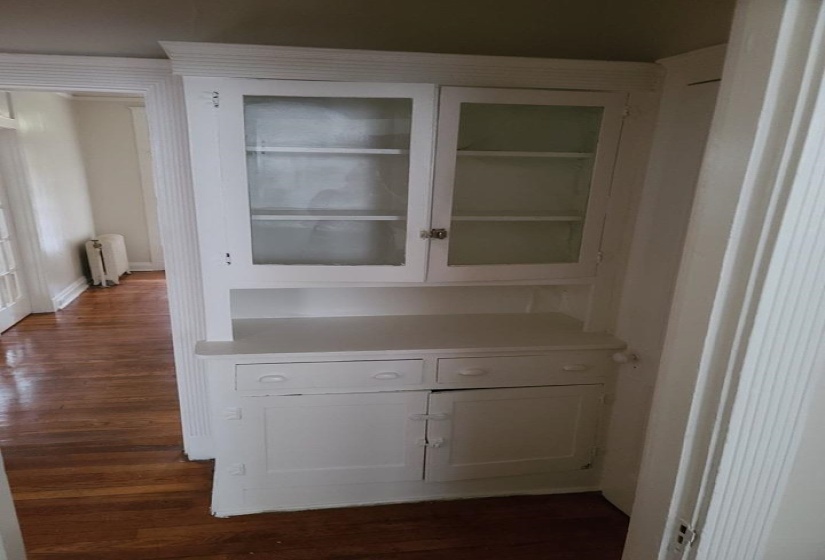 Detailed view of wood finished floors and radiator