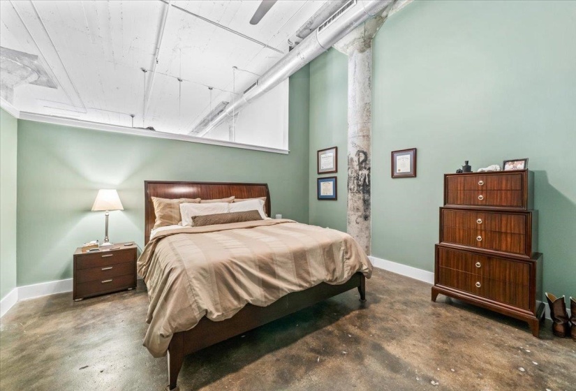Bedroom featuring concrete floors