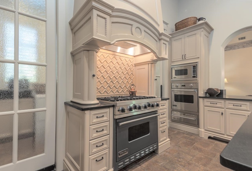 Viking gas range, plus wall oven, warming drawer and microwave.