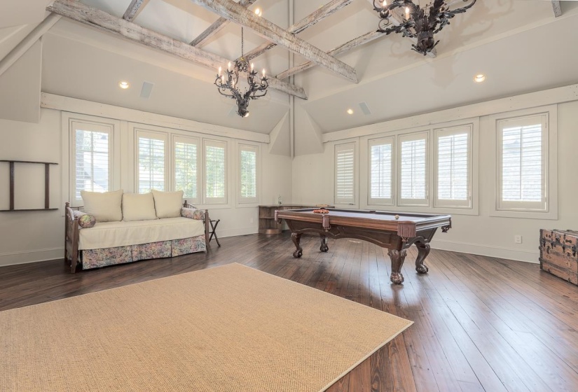 Upstairs above garage featuring heart of pine floors, and a fireplace.