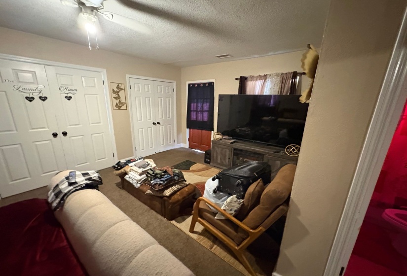 Interior space featuring light-toned walls and carpet flooring