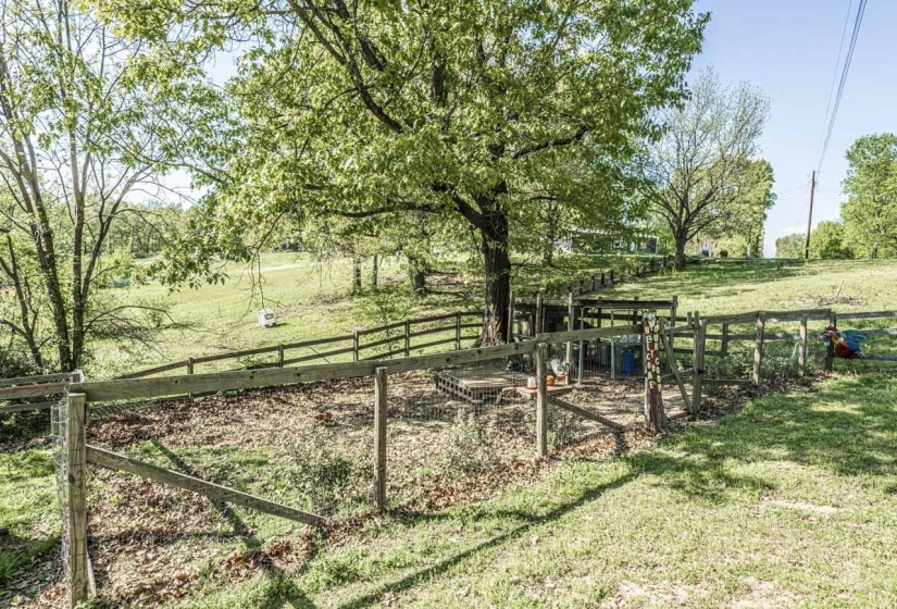 View of yard featuring a view of rural / pastoral area and a gate