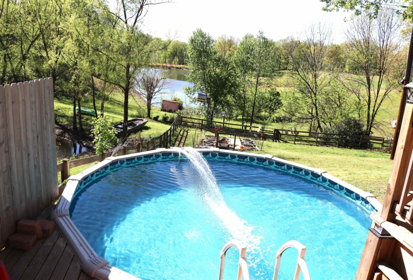 Outdoor pool featuring a fenced backyard
