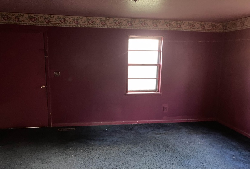 Great room with dark colored carpet