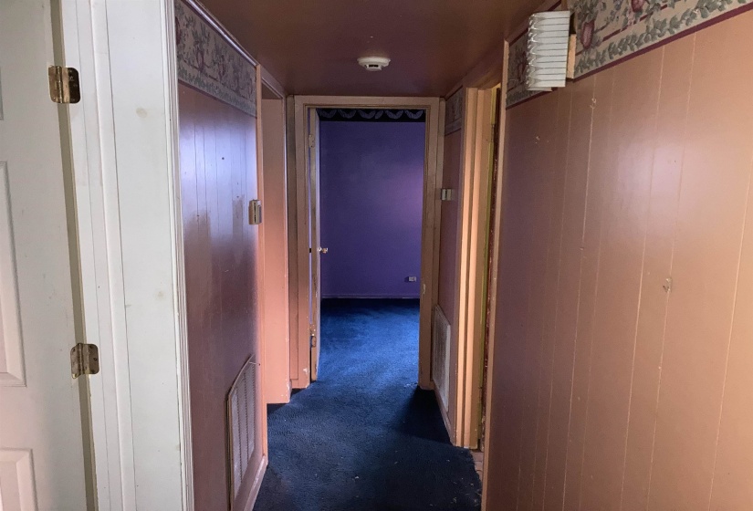 Corridor with dark carpet