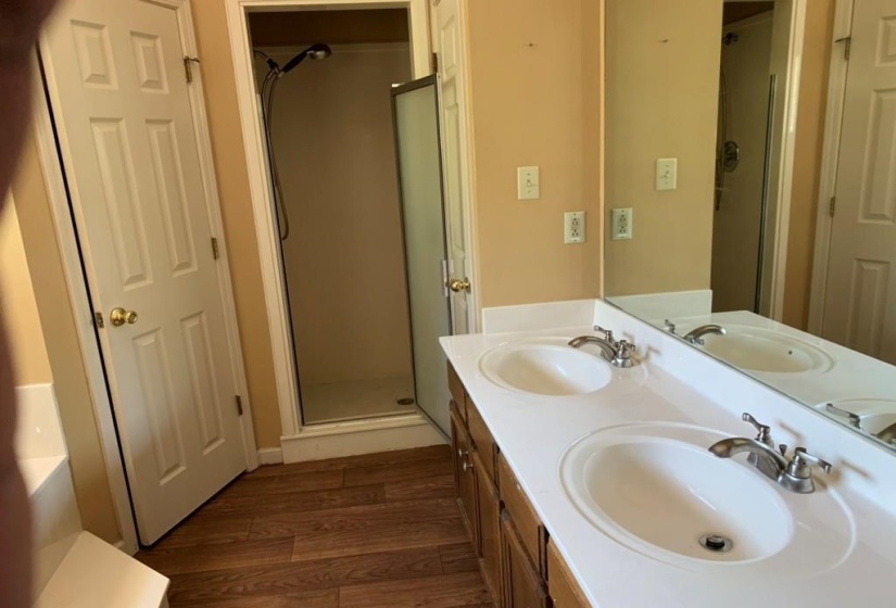 Double vanity with integrated sinks and chrome fixtures
