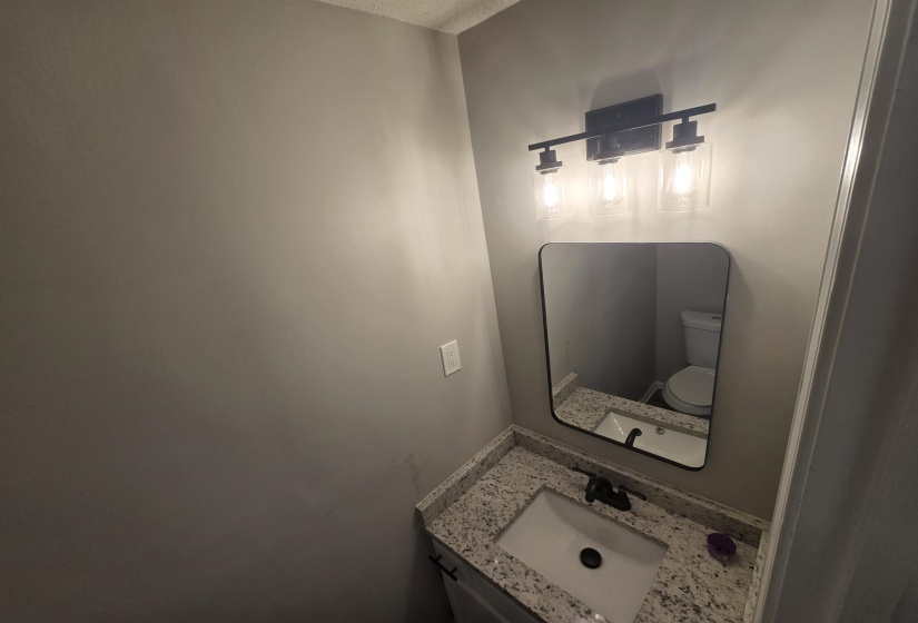 Bathroom with vanity and toilet
