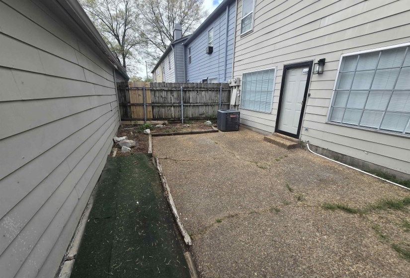 Fenced yard featuring a patio