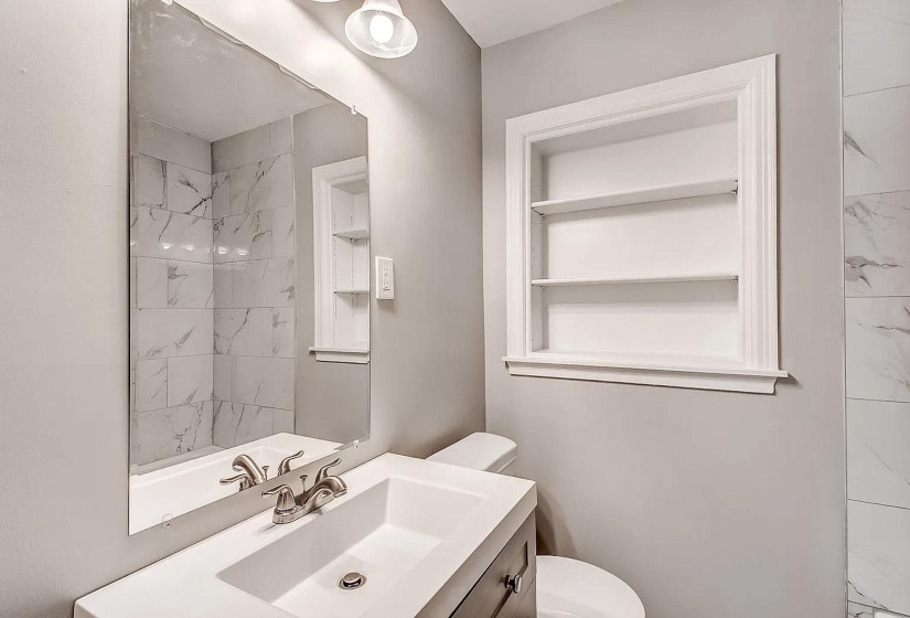Bathroom featuring vanity and built in features