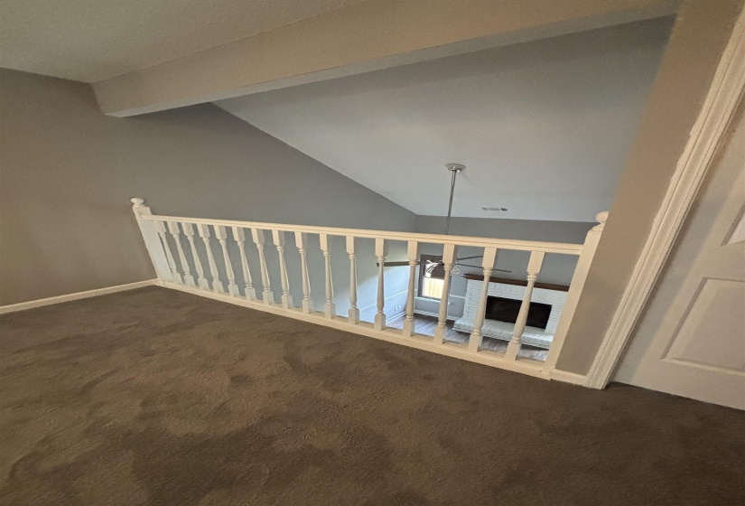 Staircase with carpet flooring and beamed ceiling