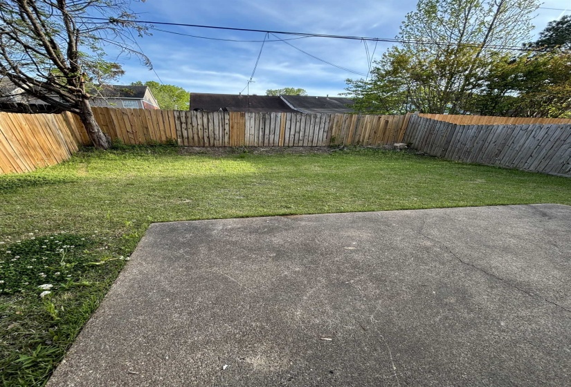 View of fenced backyard