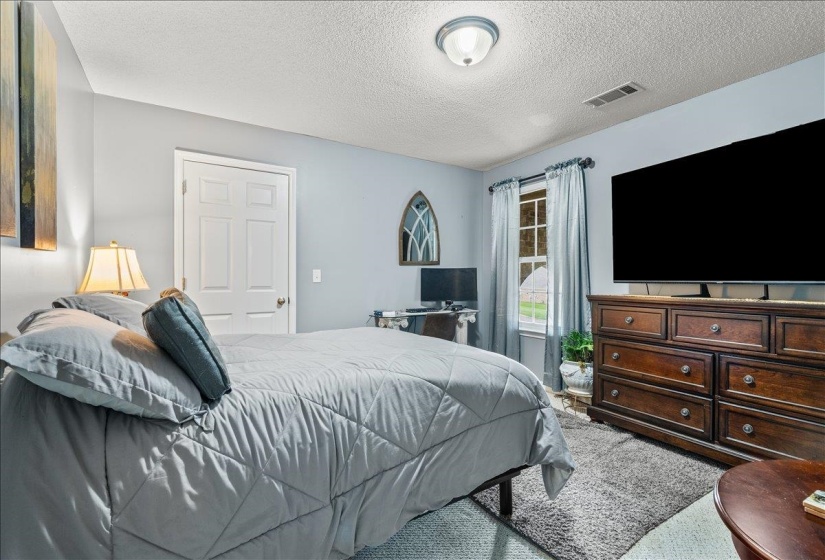 Light blue wall paint and ceiling-mounted light fixture