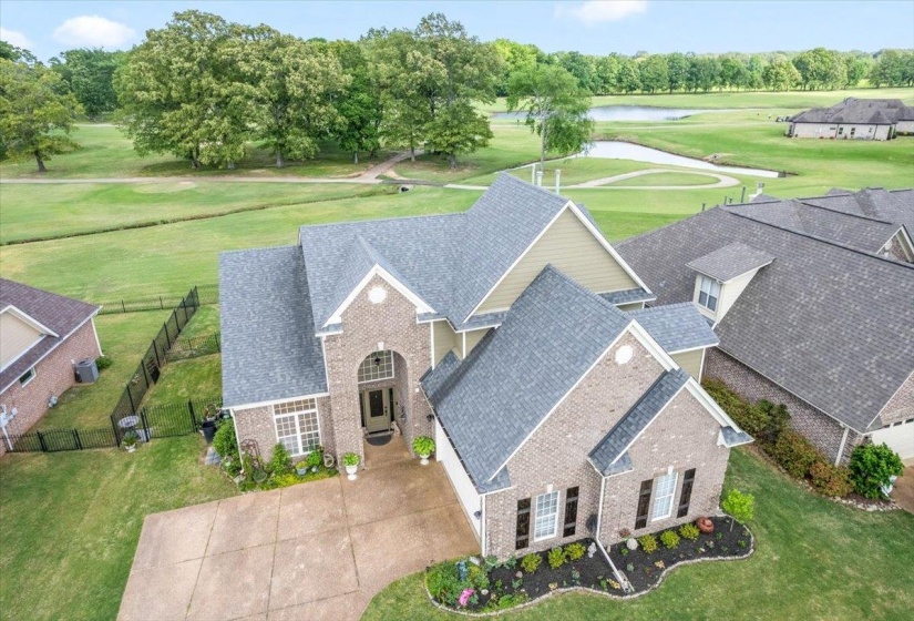 Aerial view of a golf club and a nearby body of water