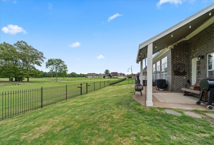 Fenced backyard featuring a patio