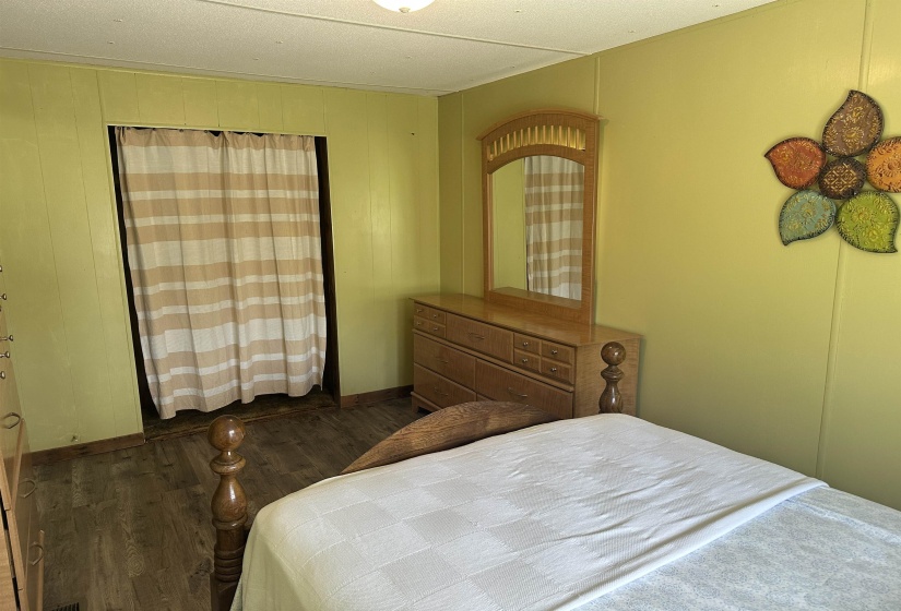 Bedroom featuring dark wood-type flooring