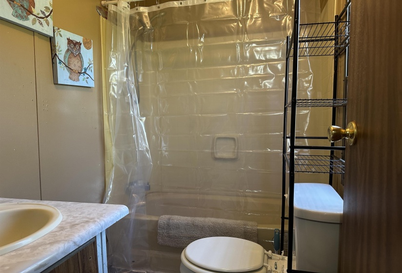 Full bath with vanity and shower / bath combination with curtain
