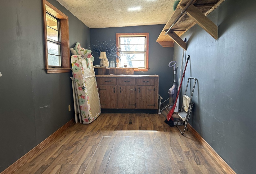 Entryway featuring dark wood finished floors and a textured ceiling