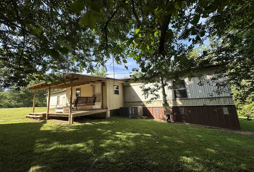 Expansive wooden deck with a covered porch