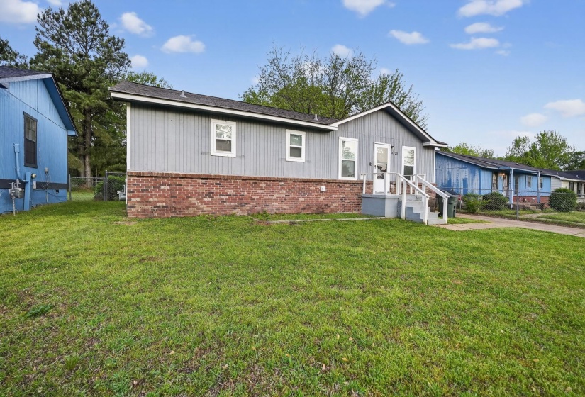 View of front of house with brick siding