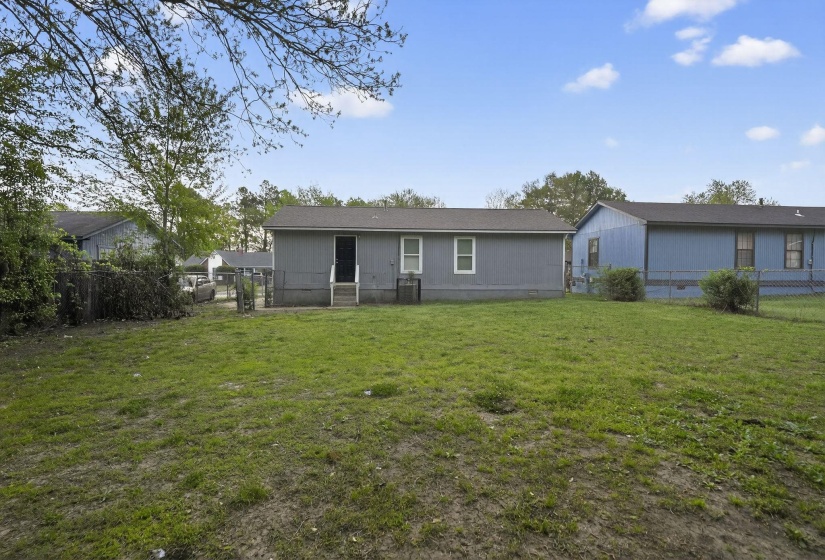 Rear view of property with crawl space