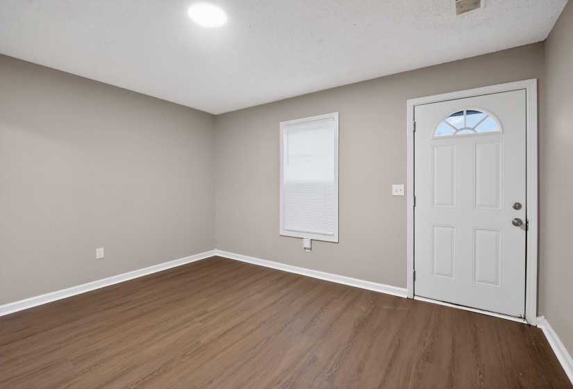 Entryway with dark wood-type flooring and plenty of natural light