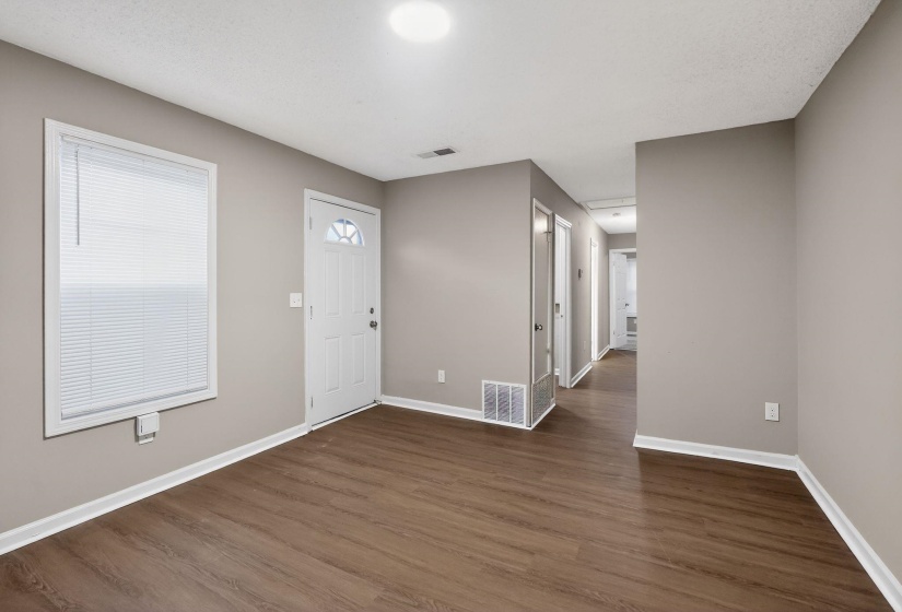 Foyer entrance featuring dark wood-style floors