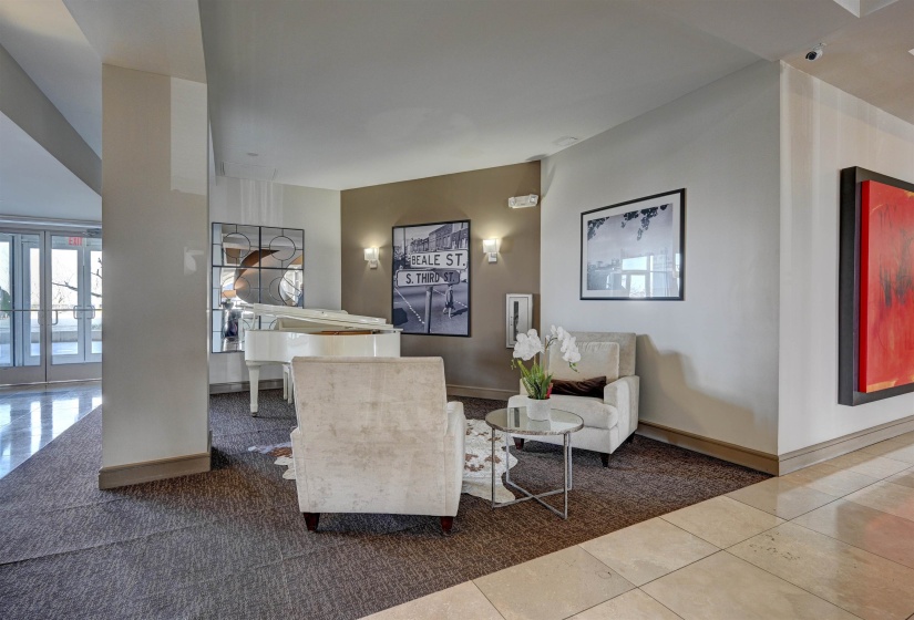 Tiled living area featuring baseboards