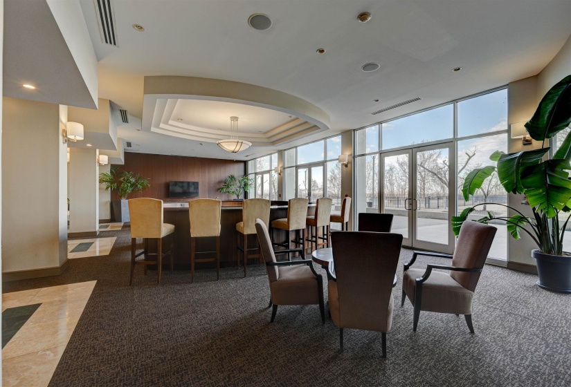 Common area with floor to ceiling windows