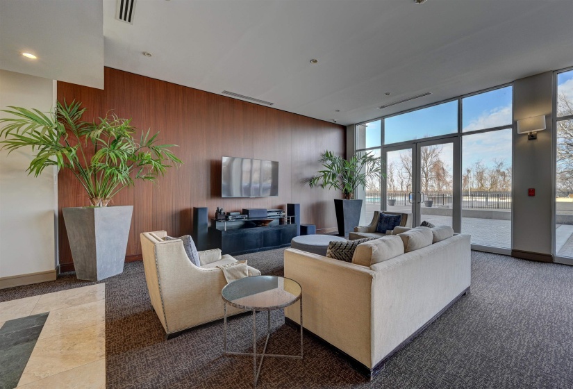 Building lobby featuring a wall of windows and wooden walls