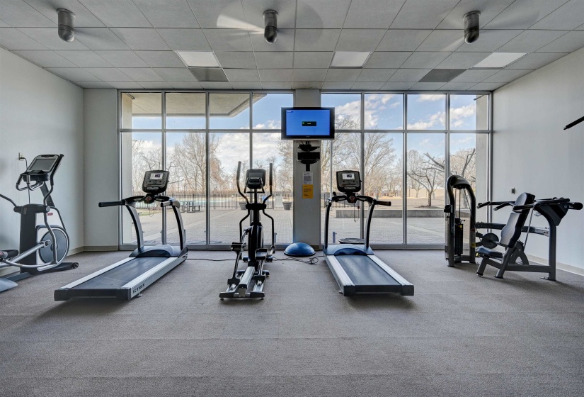 Workout area with a wall of windows