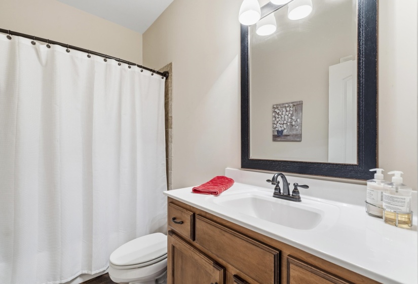 Full bathroom featuring a shower with curtain and vanity