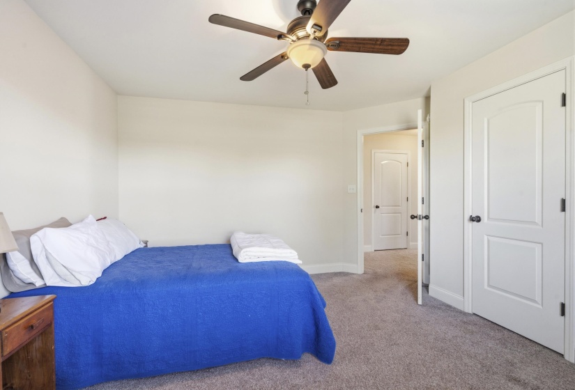 Bedroom featuring carpet flooring and a ceiling fan