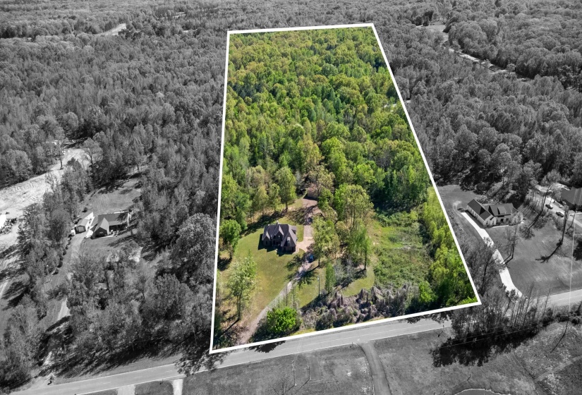 Aerial overview of property's location with property parcel outlined