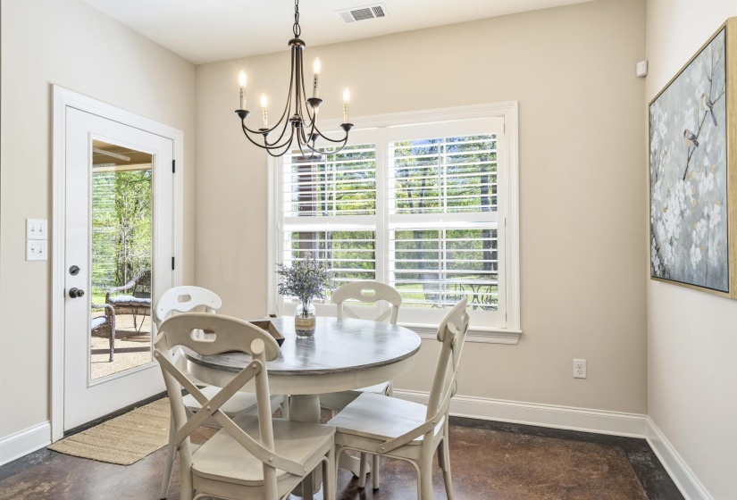 Dining room with baseboards and hanging lights