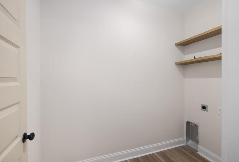 Laundry area featuring light wood-style flooring and hookup for an electric dryer