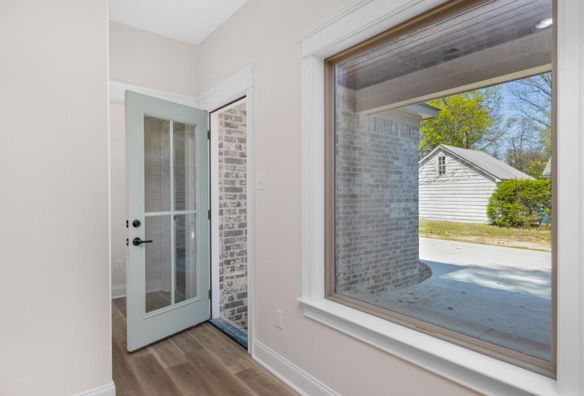 Entryway featuring baseboards and wood finished floors