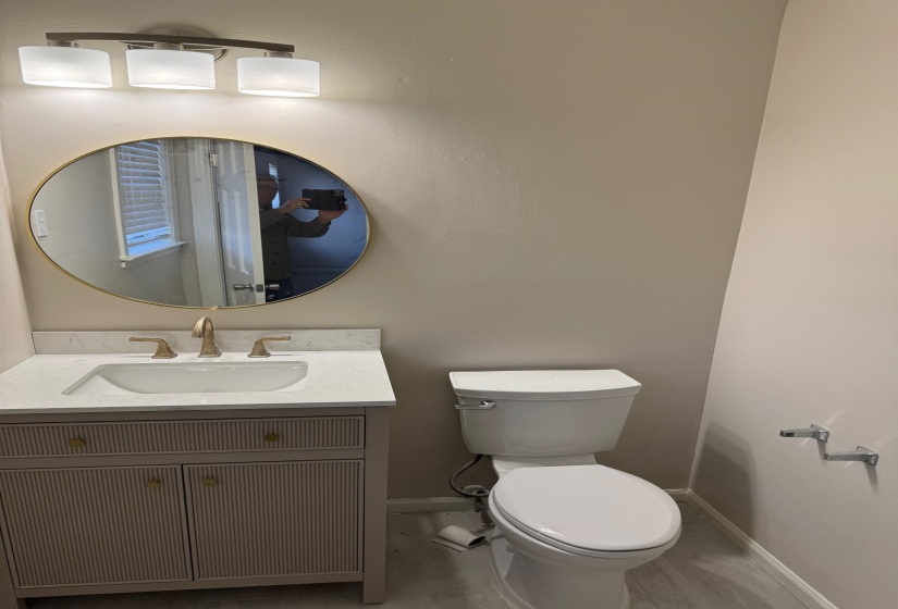Bathroom featuring vanity and toilet