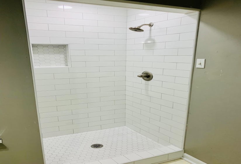 Bathroom with tiled shower