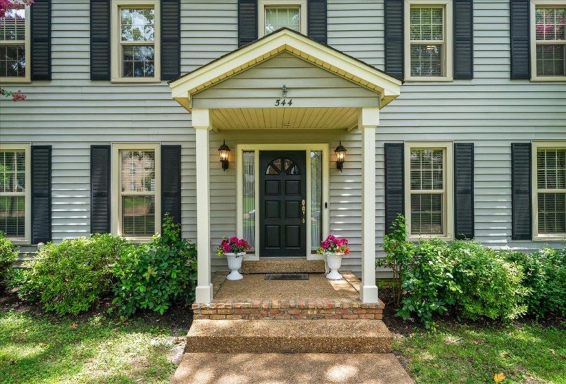 Property entrance featuring covered porch