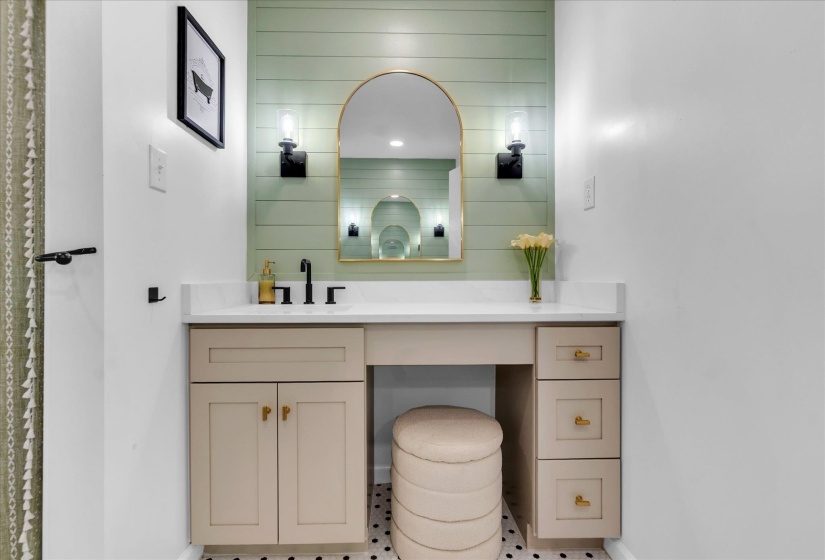 Bathroom featuring vanity and baseboards
