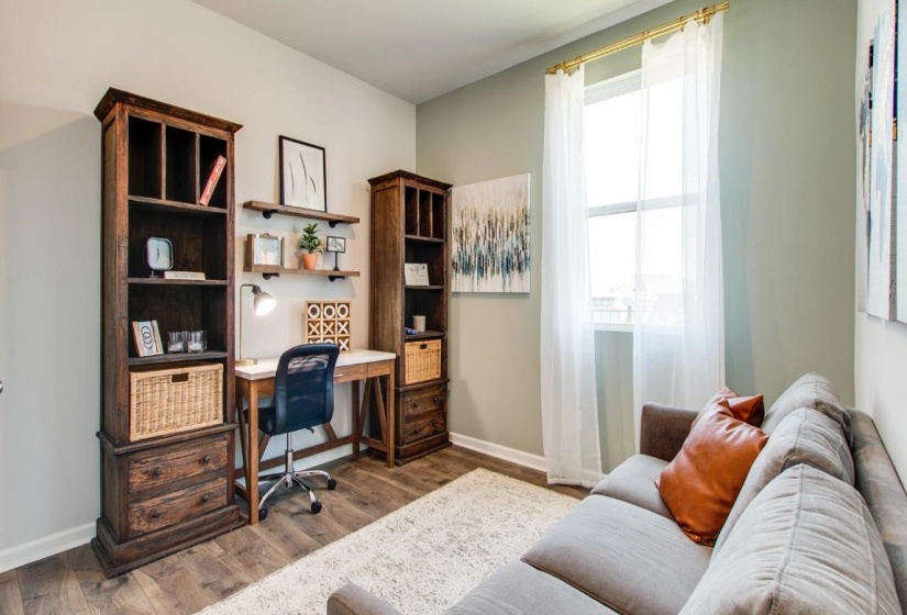 Office area with dark wood-style floors