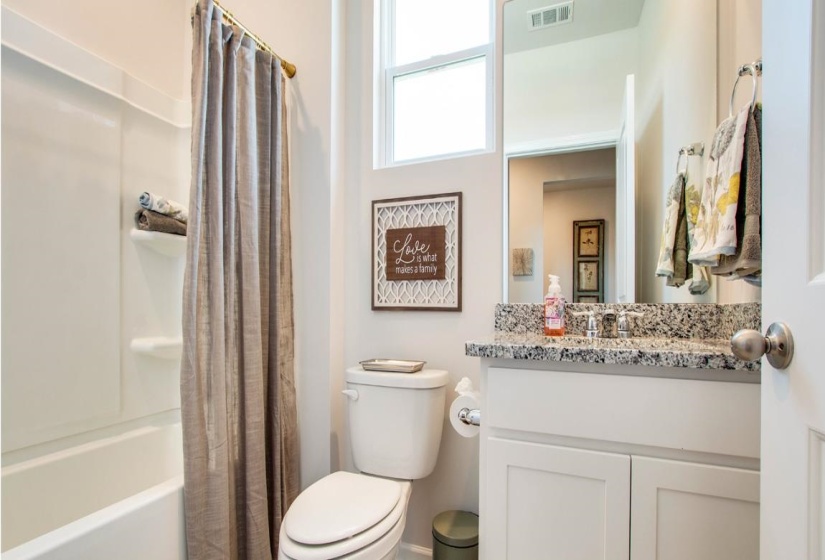 Full bathroom featuring vanity and shower / bath combo