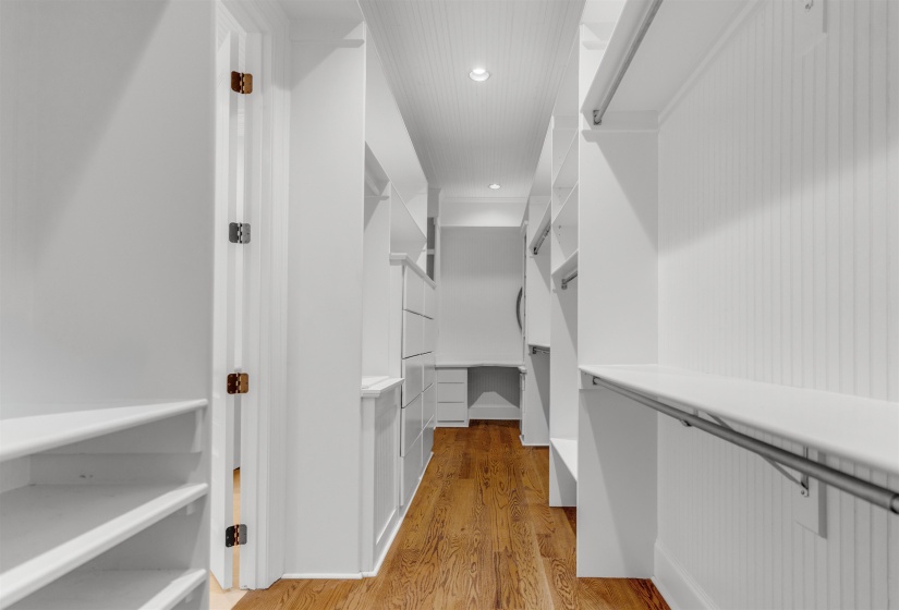 Spacious closet with light wood-style floors