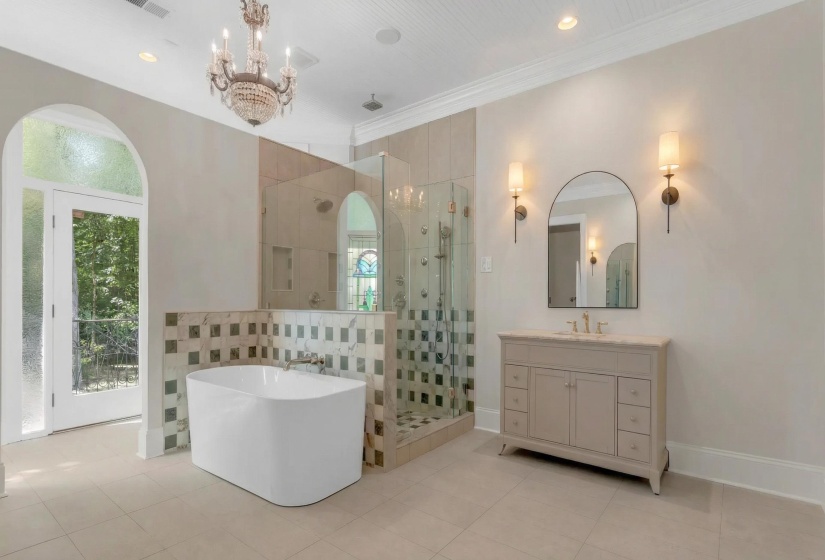 Full bathroom with vanity, a stall shower, a soaking tub, crown molding, and light tile patterned flooring