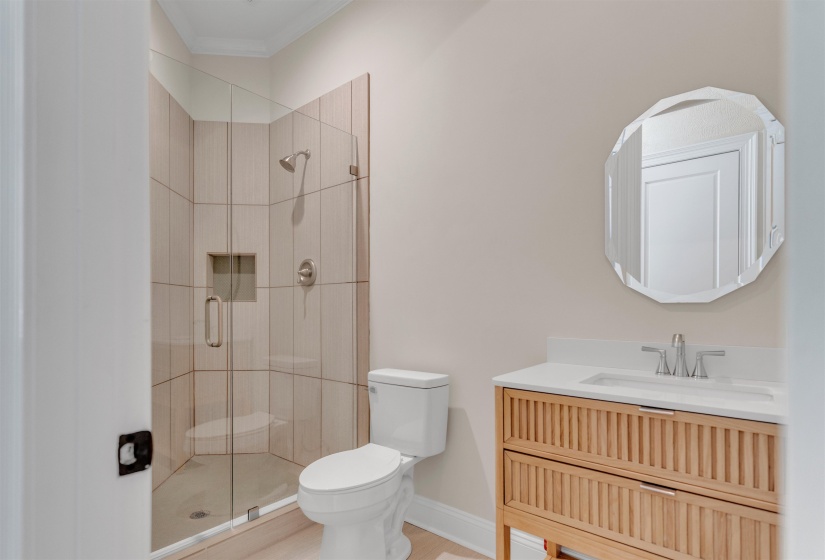 Bathroom with a stall shower and vanity