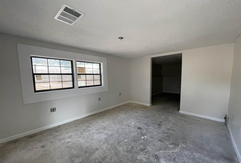Empty room with a textured ceiling