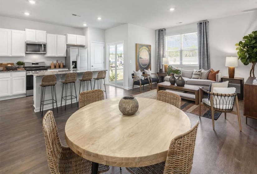 Dining area featuring recessed lighting, baseboards, dark wood-style flooring, and visible vents