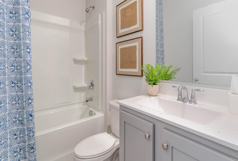 Bathroom featuring vanity and shower / bath combo