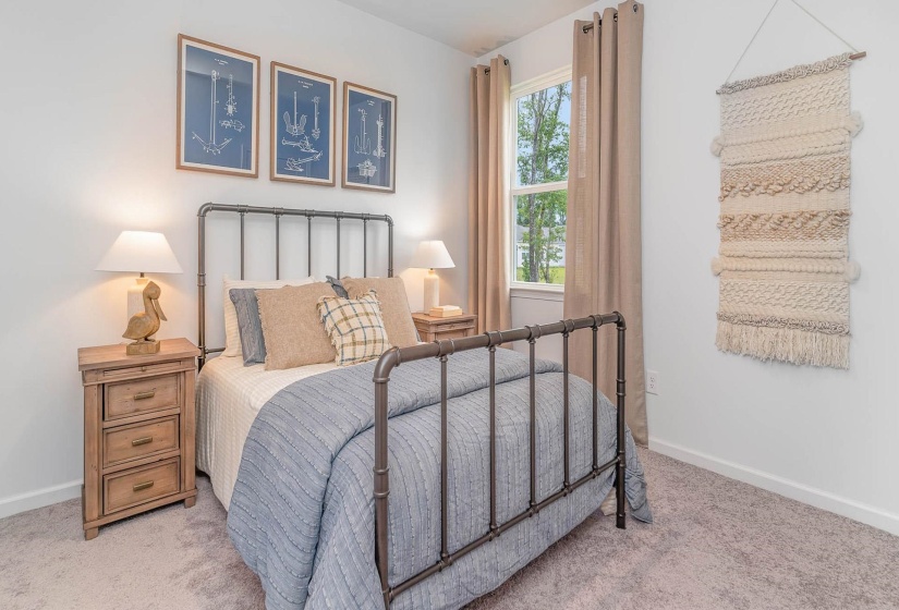Carpeted bedroom with baseboards